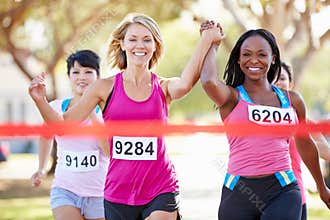 Two Female Runners Finishing Race Together