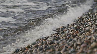 Sea Waves Washes Pebble Beach. Sea Waves Roll Ashore. Nature Concept.