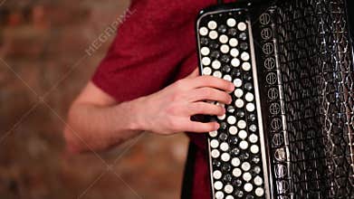 Close up of mans hand pushing buttons on