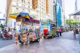 Time Square in NYC. Colorful hot dog stands selling Hot dogs and snacks are familiar fixtures of New York City.