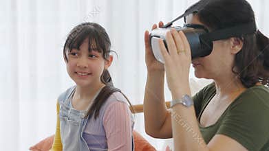 Granddaughter guide grandmother to dive in metaverse with VR. Divergence.