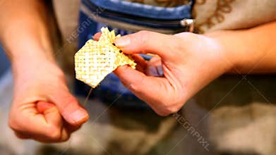 hand close up embroidering from splint by means of