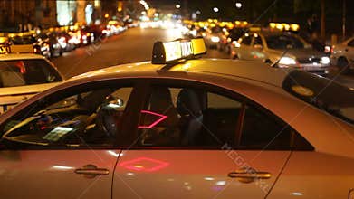 Taxi driver sitting in cab and waiting for