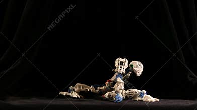 Robot dance on black background. Time