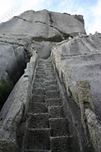 Stone steps on rock cliff