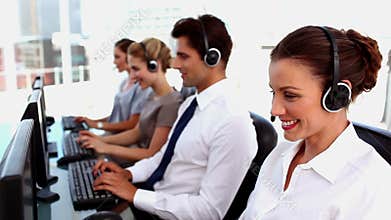 Smiling call centre agents with headset