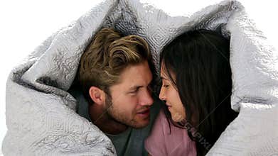 Couple chatting under the covers