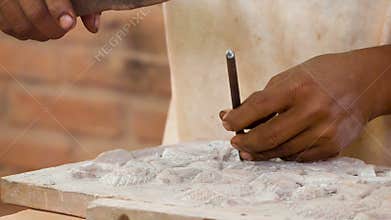 Work on stone carvings. Stone workshop in Cambodia