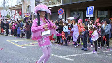 Men in wigs and dressed in burlesque female clothes during carnival in Torres Vedras, Portugal