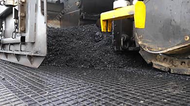 Special machinery making road in countryside area. Compactor constructing highway. Heavy machinery repairing road. Slowly driving