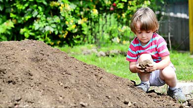 Kid playing with clay