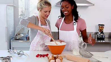 Two friends home baking together