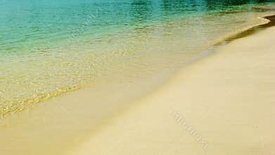 Calm tropical sea and a sandy beach