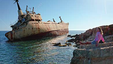 Woman relaxing at Edro III shipwreck in Peyia, Cyprus