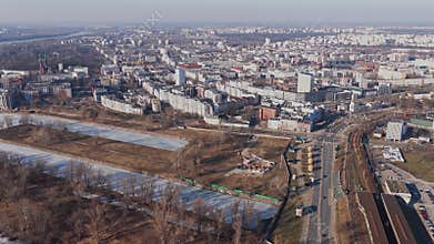 Aerial panorama of Warsaw Vistula riverfront with bridges and rail