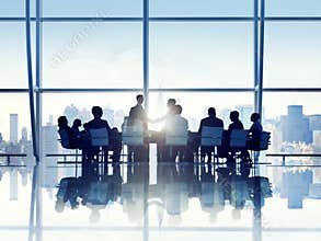 Silhouette of Business Person in a Board Room