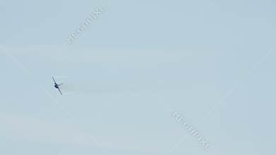 Fighter Jet Performing Aerobatics in Blue Sky