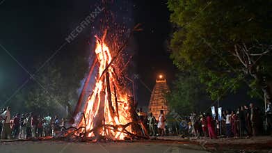 Holika Dahan, ritual bonfire, evening before the holi festival in India, symbol for burning the evil, triumph of good, Hampi,