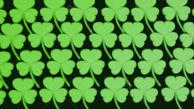 A seamless pattern of green three-leaf clovers or shamrocks