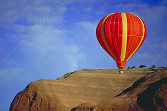 Balloon flying over Red Rock, New Mexico