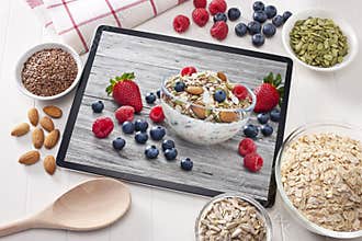 Computer Tablet Cereal Berries Nuts Grains Breakfast