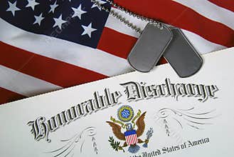 military dog tags on honorable discharge document