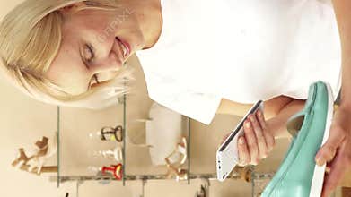 Woman captures a stylish shoe in a chic boutique