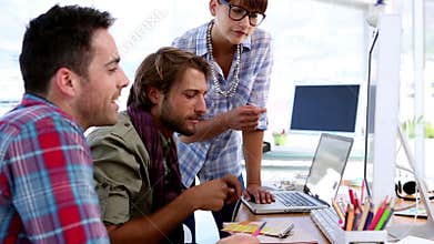 Team of designers working on computer