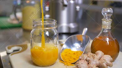 Pouring Fresh Healthy Organic Juice Into Clean Jar