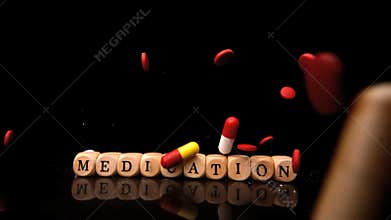 Pills falling and rolling over dice spelling medication