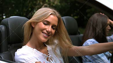 Woman smiling while her friend is sad