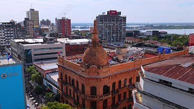 Erial view of the Museum of Economy in Asuncion with city skyline and river backdrop