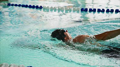 An Aspiring Swimmer Perfects Their Stroke in a Competitive Pool, Overcoming Waves and Challenges with Dedication and Technique for