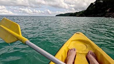 Pov of paddling in a yellow kayak in Cheow Lan Lake