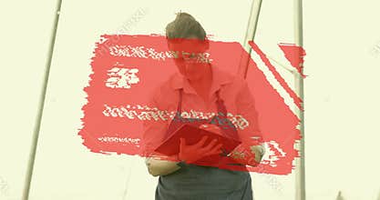 Horticulturist tapping tablet causing red card overlay, crouching inspecting roots for health