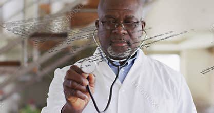 Transparent text overlay fading revealing male doctor inspecting stethoscope offering reassurance