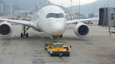airside view in HKG Hongkong Airport while ground service staffs doing ground service operation push back Philippines airline