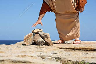 Man by stones concept Sin Punishment