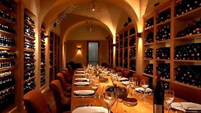 Cozy Wine Cellar Featuring a Beautifully Set Table and Arched Ceilings