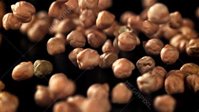 Chickpeas fall on the table. Filmed on a high-speed camera at 1000 fps.