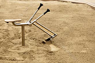 Metal sandbox digger in playground