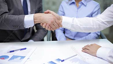 Two businessmen shaking their hands
