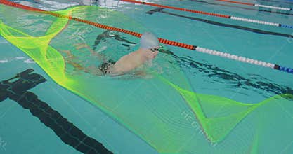 Gliding male swimmer wearing goggles in pool lane, with lane dividers and neon mesh overlay