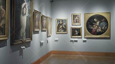 Soft blurred museum gallery wall with framed paintings and labels, shallow defocused focus conveying empty exhibit corridor;