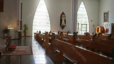 Church interior with wooden pews, altar and arched windows, blurred shallow bokeh focus background; background backplate copyspace