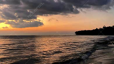 Golden Hour Serenity Tropical Ocean Sunset with Dramatic Clouds