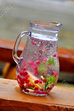Pitcher of water and fruit.