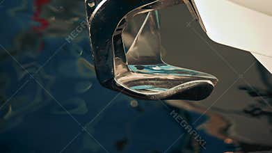 A chrome boat anchor with smooth curves,