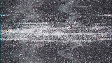 Abstract digital glitch effect with sparkling particles in motion