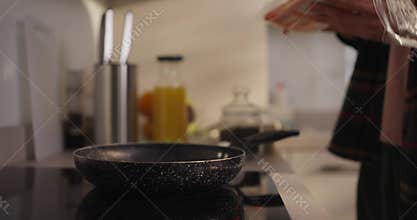 A passionate cook crafts a delightful dish in a warm kitchen, highlighting culinary skills and fresh ingredients